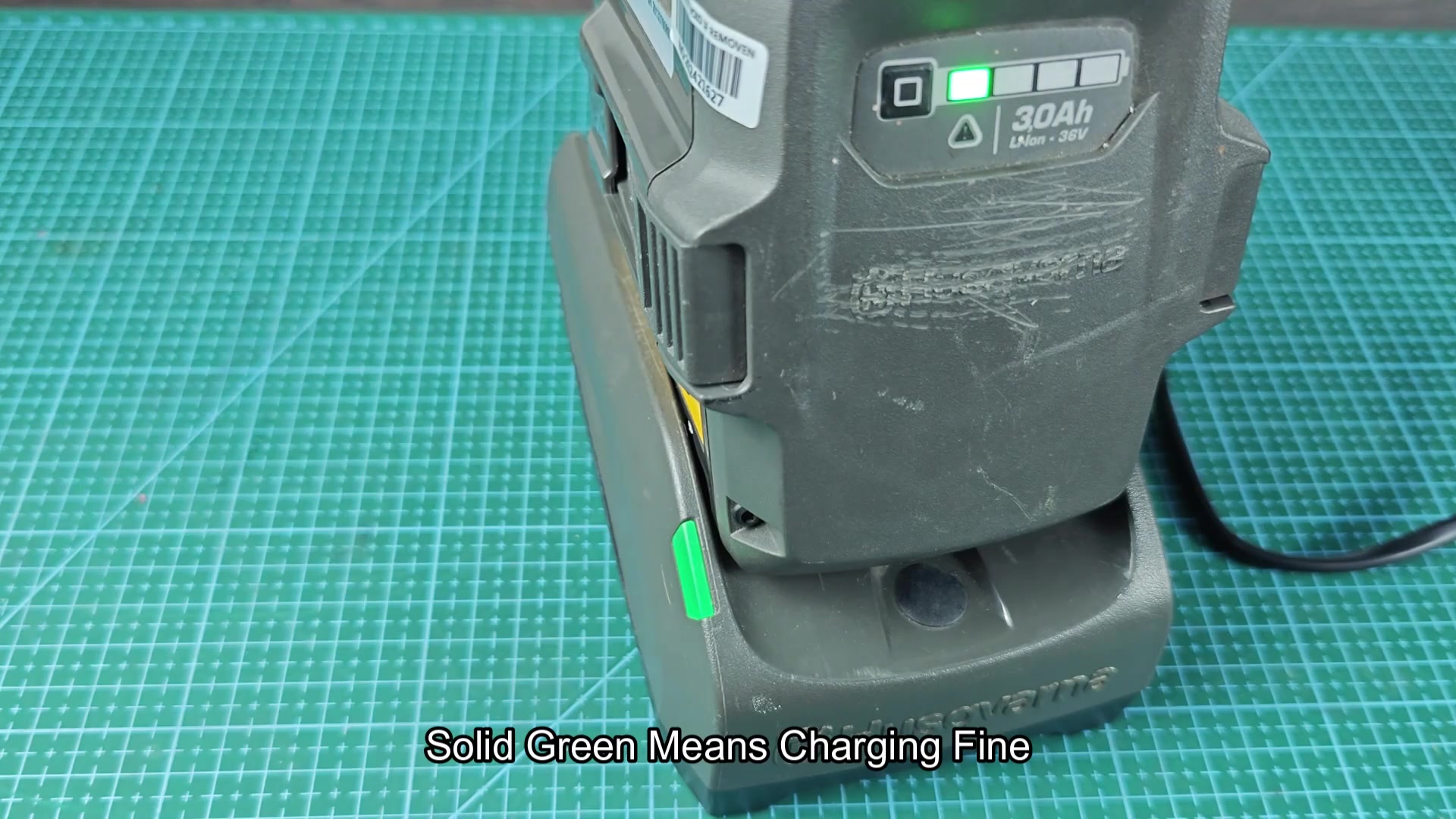 Husqvarna 36V battery showing three green bars charging
