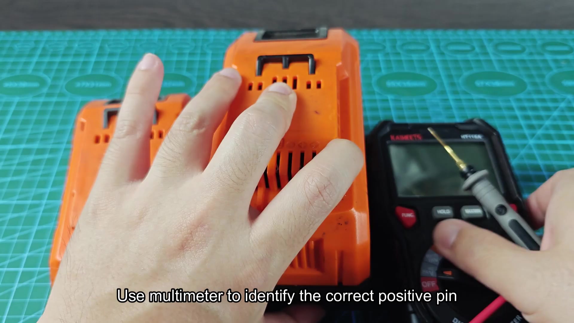 Multimeter checking Atlas battery voltage pins