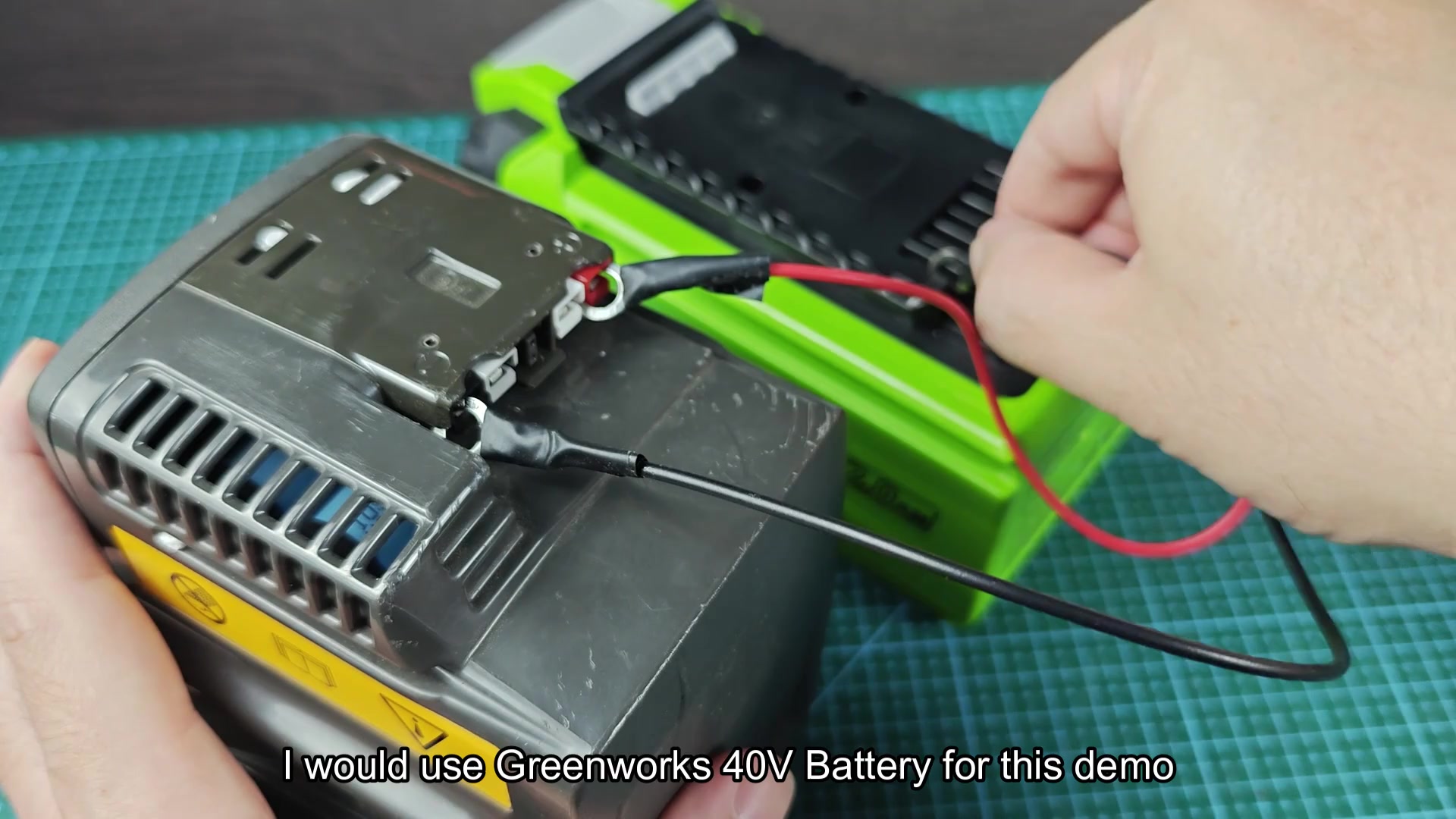 Red and black leads connecting two battery packs