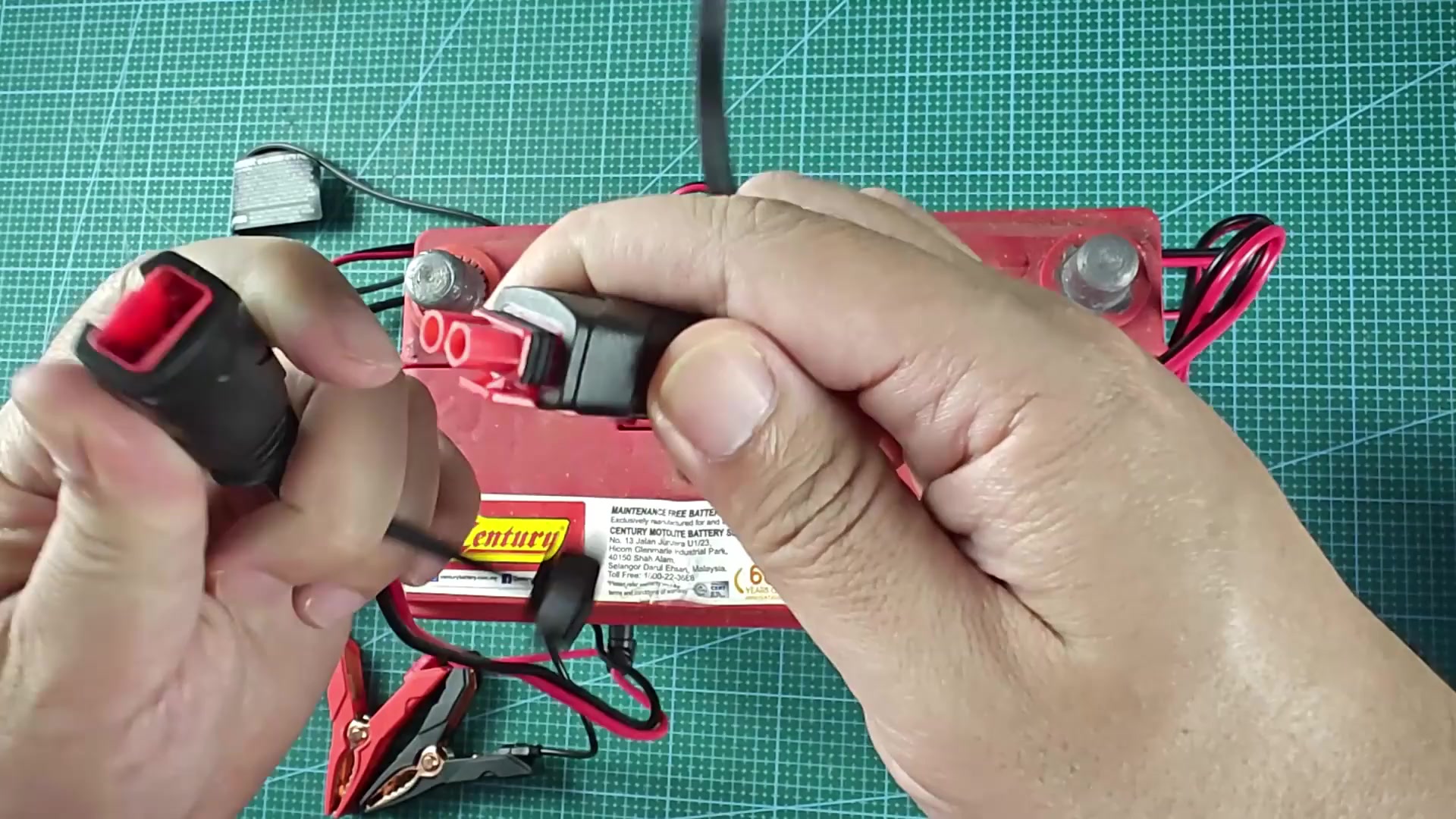 Red locking connector tab snapping into place Red locking connector tab snapping into place