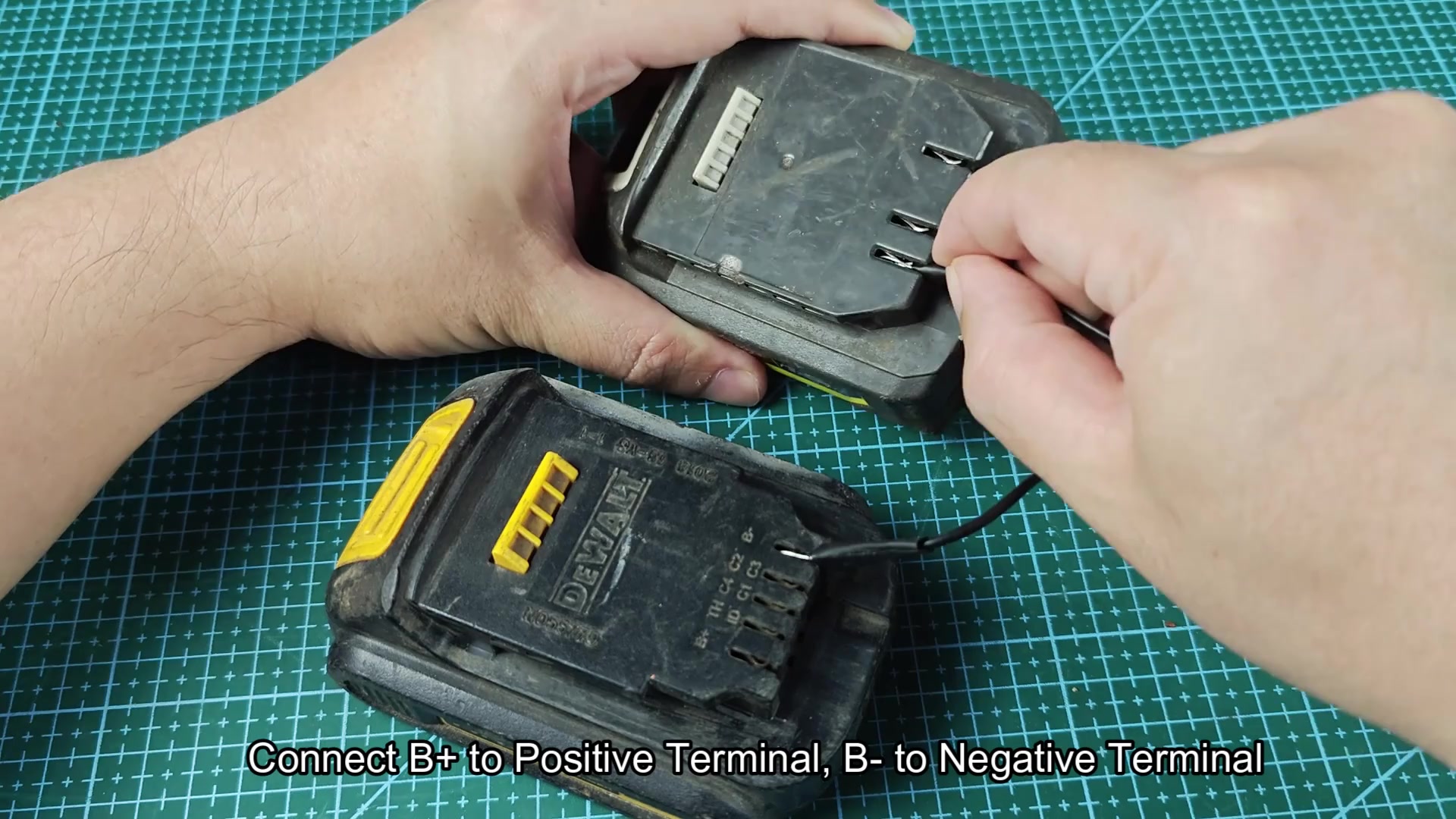 Ryobi and DEWALT batteries linked by wire Ryobi and DEWALT batteries linked by wire