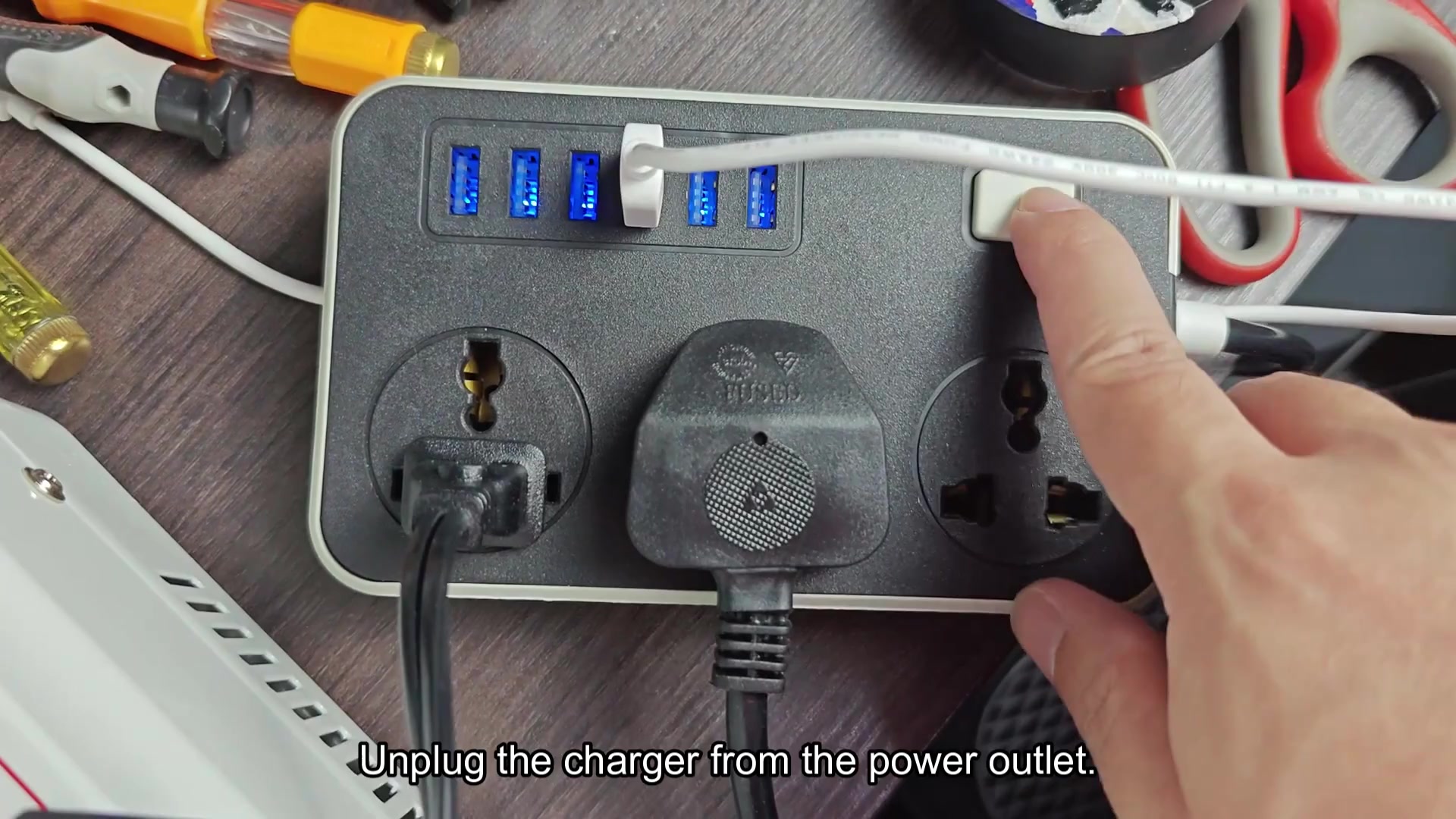Unplugging charger from power strip Unplugging charger from power strip