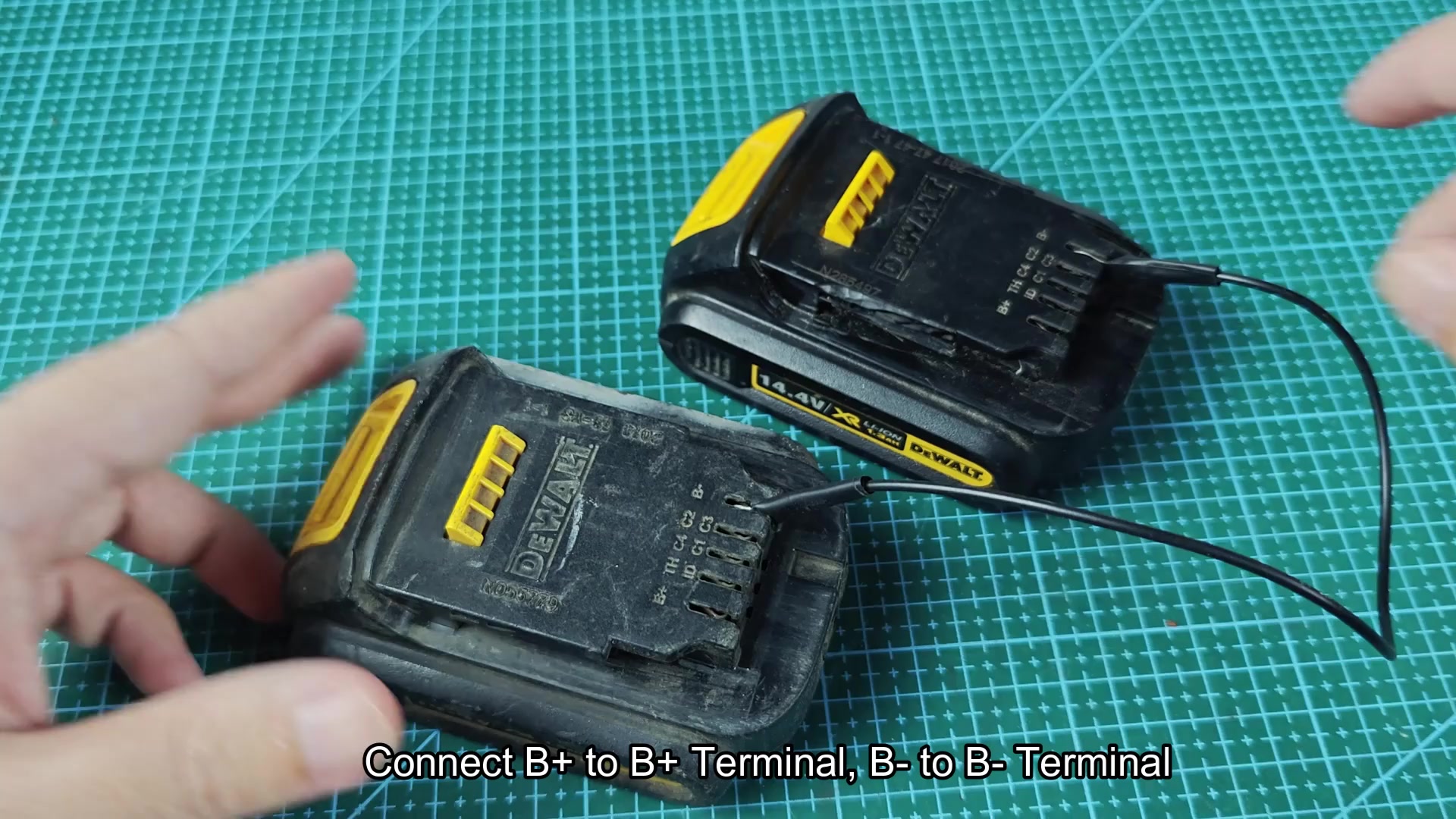 Wire bridging both DEWALT battery terminal areas Wire bridging both DEWALT battery terminal areas