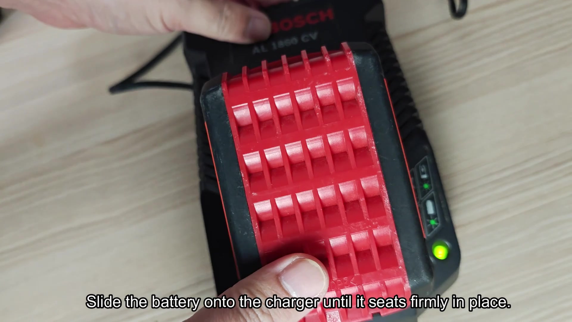 Battery seated on BOSCH charger base Battery seated on BOSCH charger base