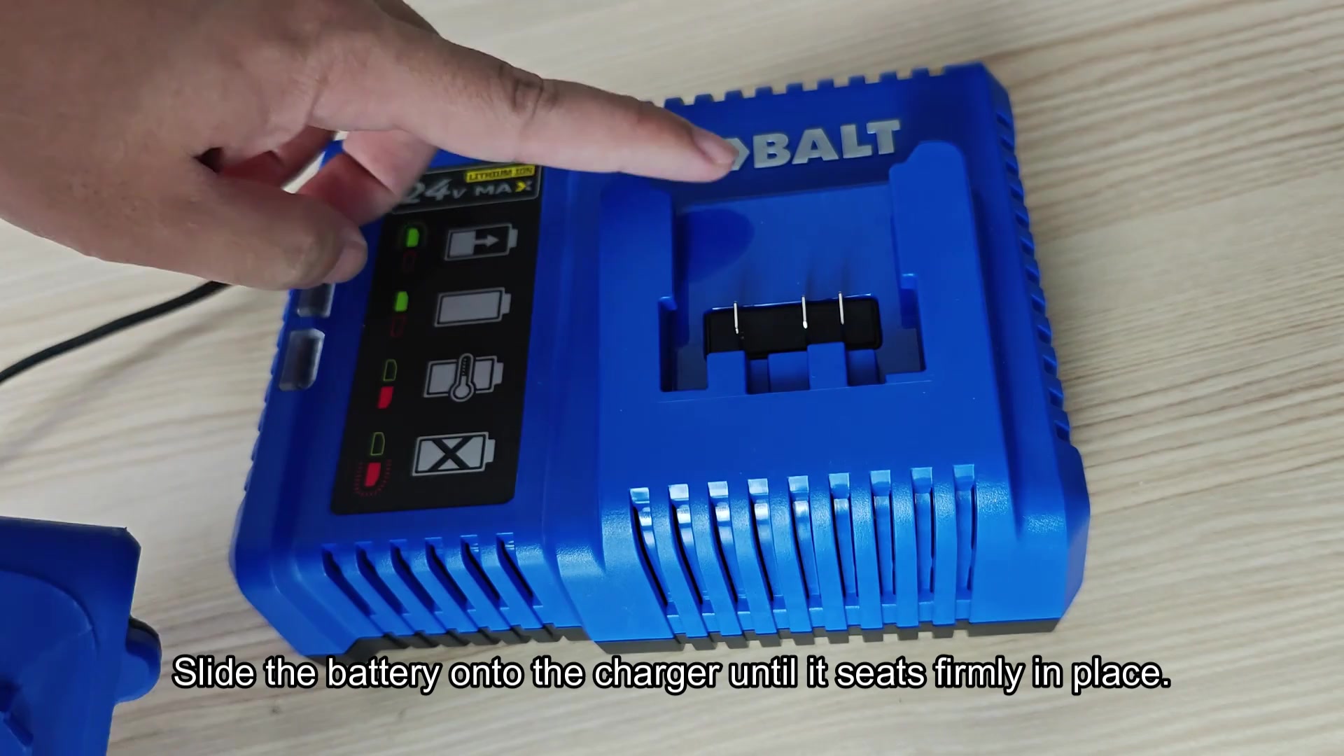 Blue Kobalt 24V MAX charger on table Blue Kobalt 24V MAX charger on table