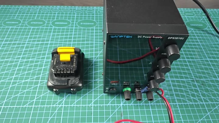 DeWalt battery next to WAPTEK DPS3010U power supply