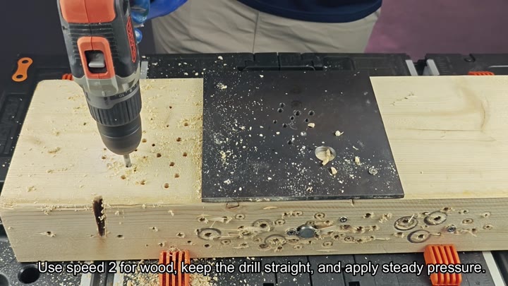 Drilling into wood with steady pressure Drilling into wood with steady pressure