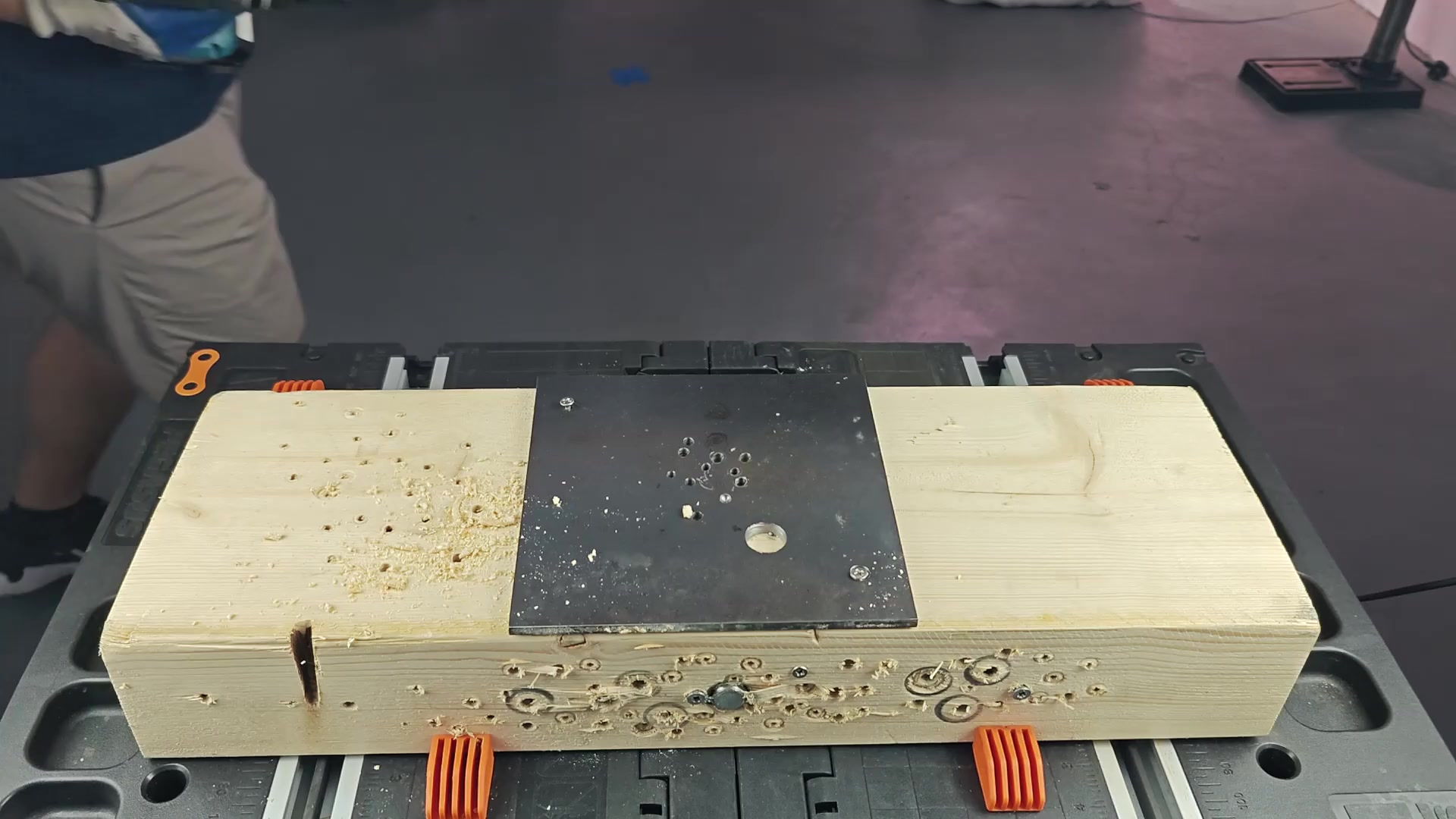 Drilling into wood with steady pressure Drilling into wood with steady pressure