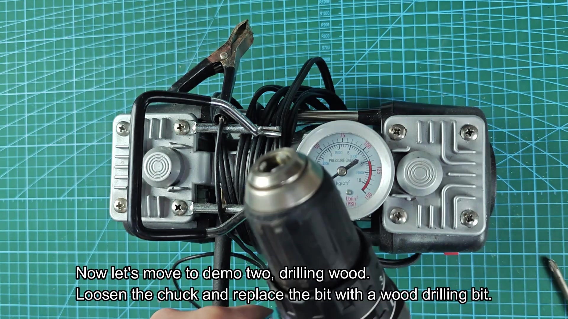 Inserting drill bit into chuck jaws Inserting drill bit into chuck jaws