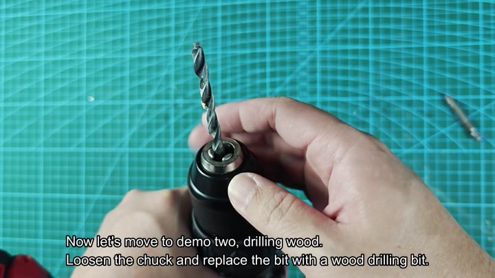 Inserting wood bit into drill chuck Inserting wood bit into drill chuck