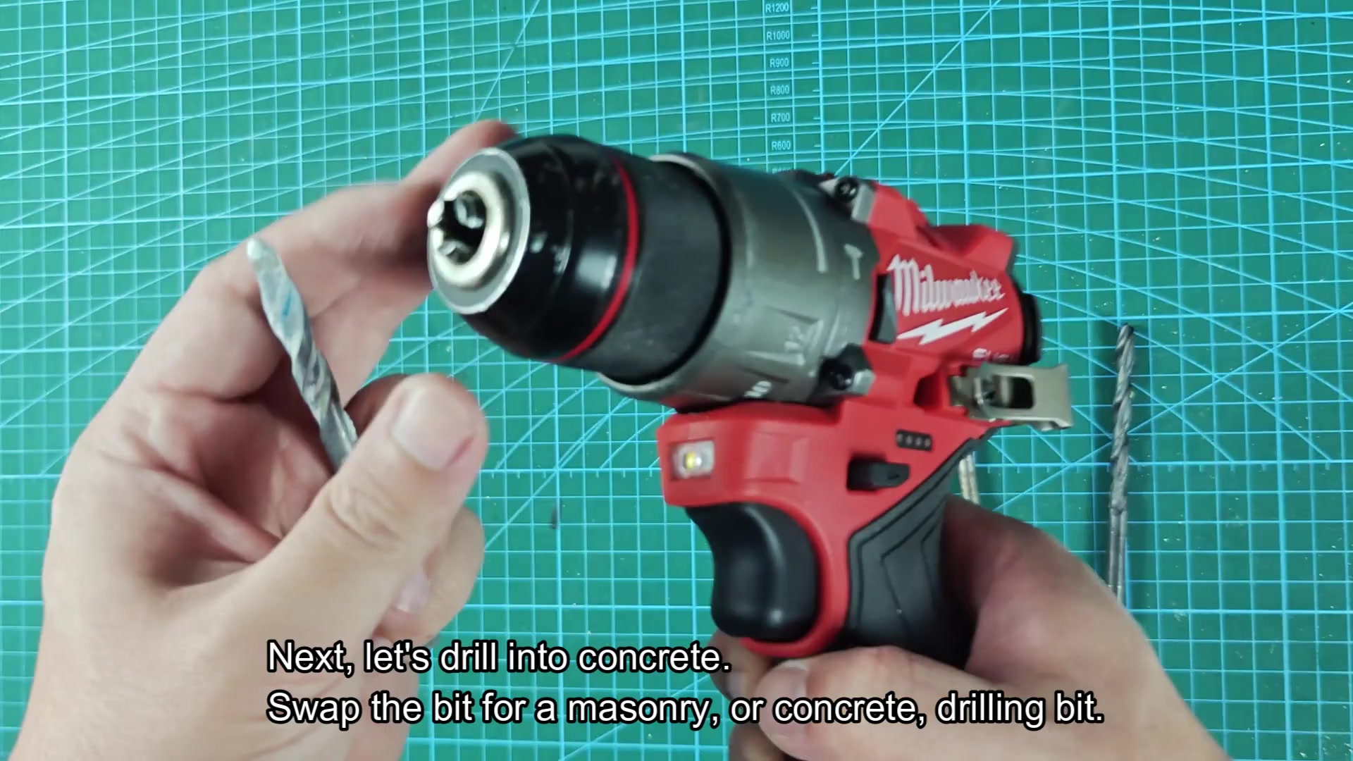 Masonry bit brought toward drill chuck Masonry bit brought toward drill chuck