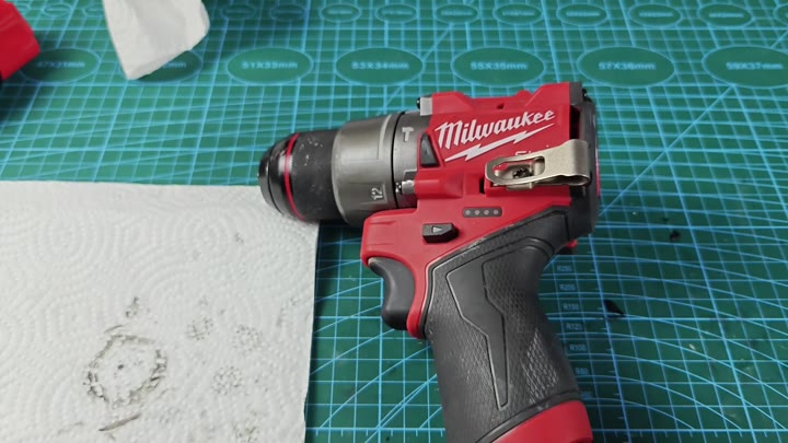 Milwaukee M12 drill on work mat