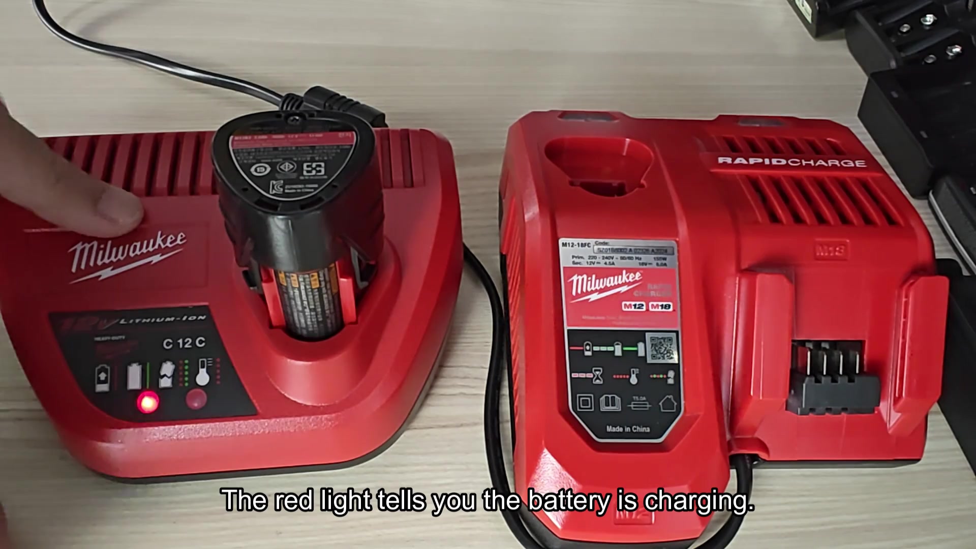 Red LED indicates charging status Red LED indicates charging status