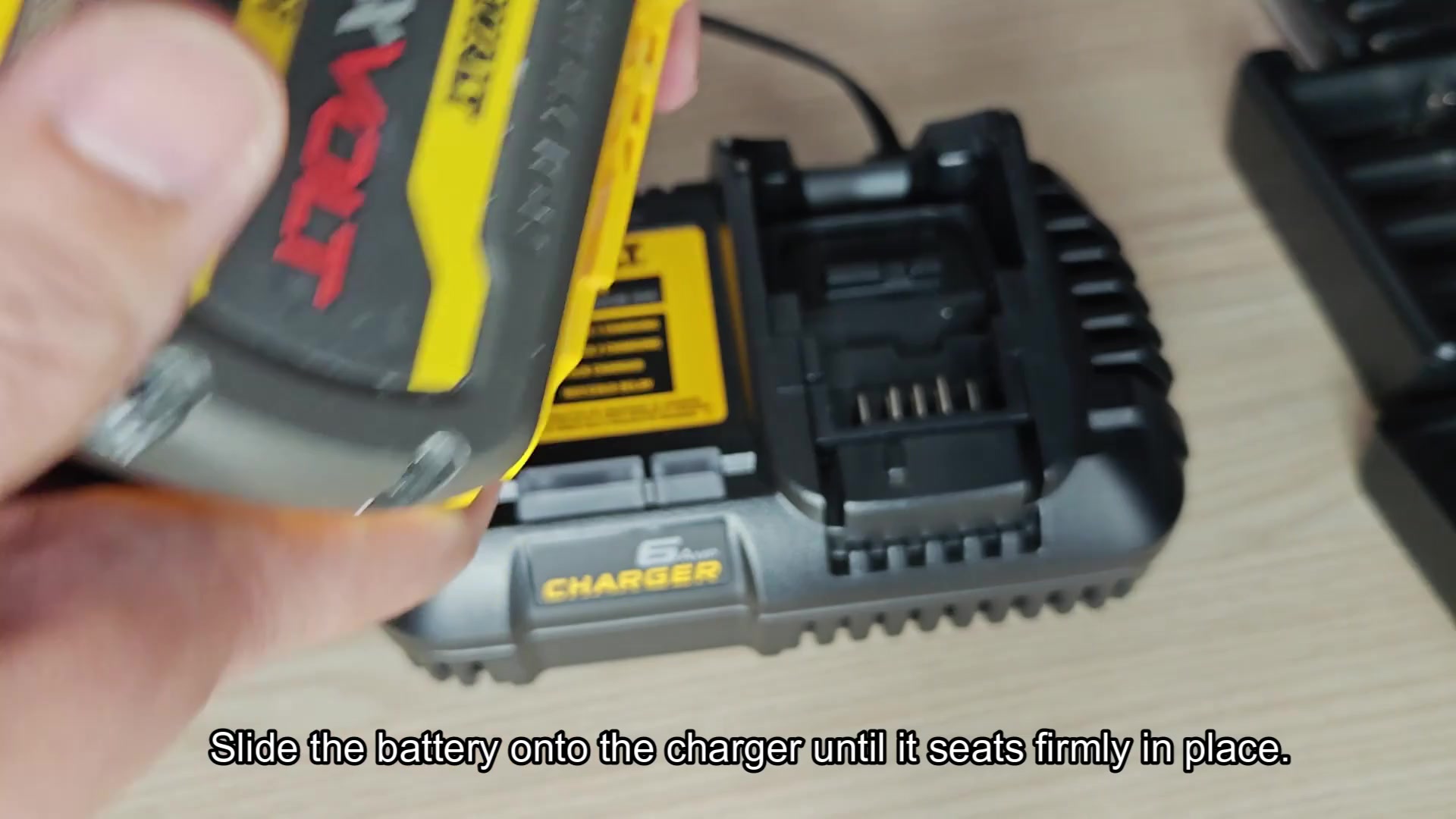 Slide battery firmly into charger slot Slide battery firmly into charger slot