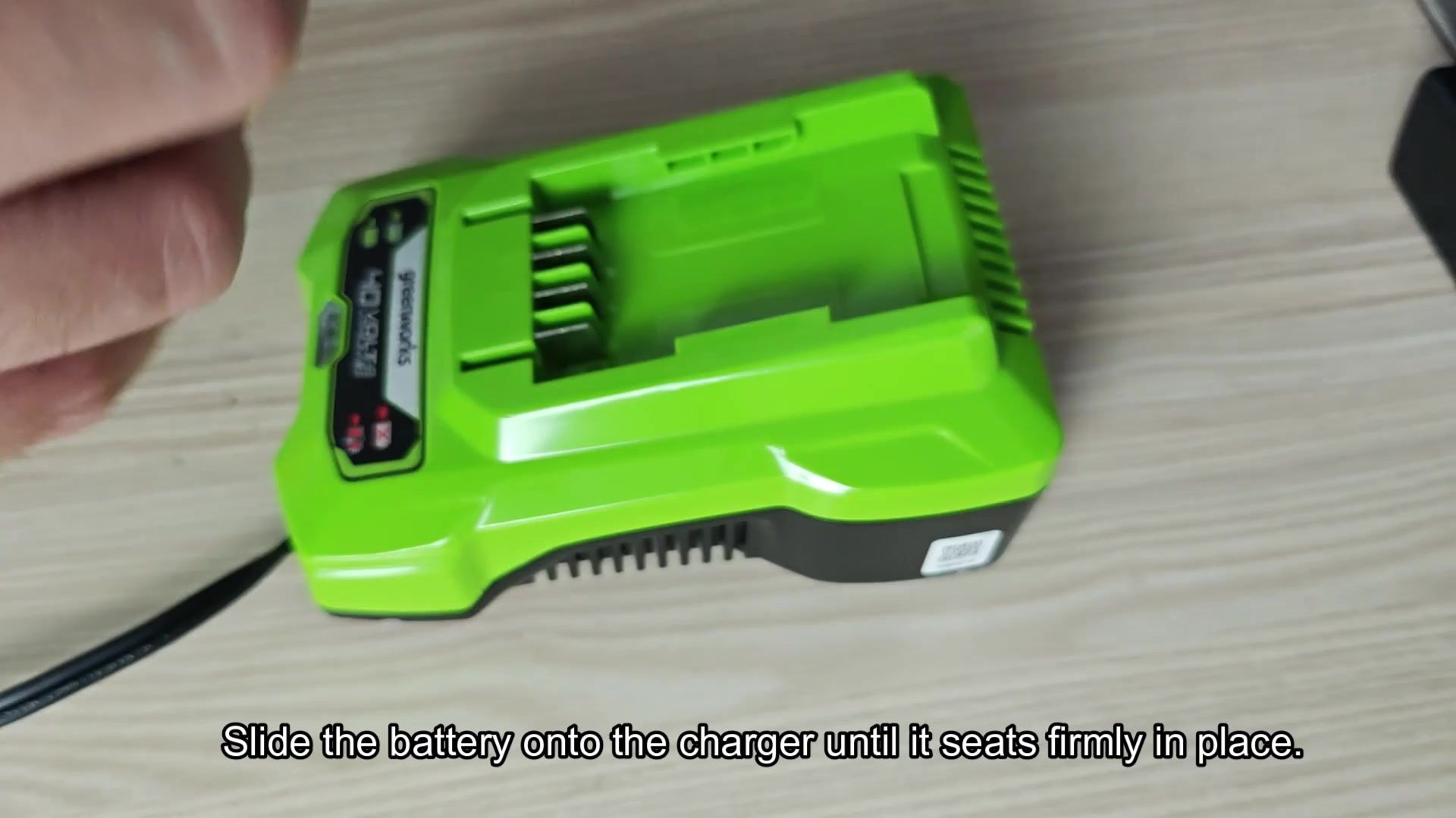 Slide battery onto charger base Slide battery onto charger base