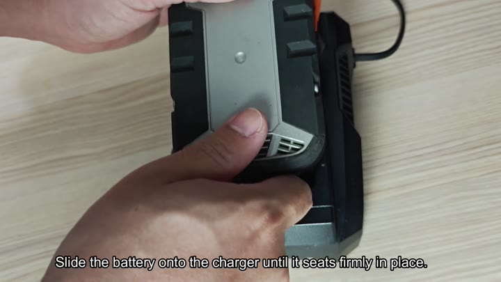 Slide battery onto charger firmly
