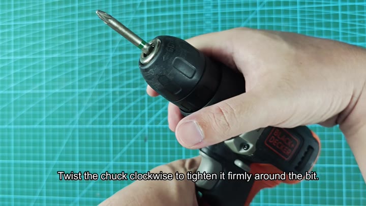Twisting chuck clockwise to tighten bit Twisting chuck clockwise to tighten bit