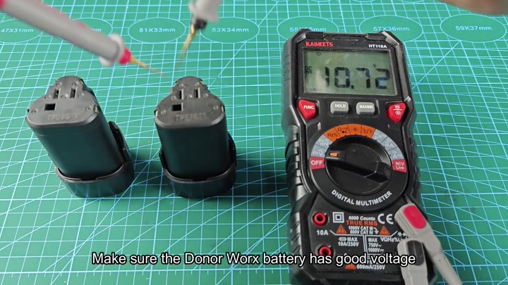 Two Worx batteries with multimeter reading