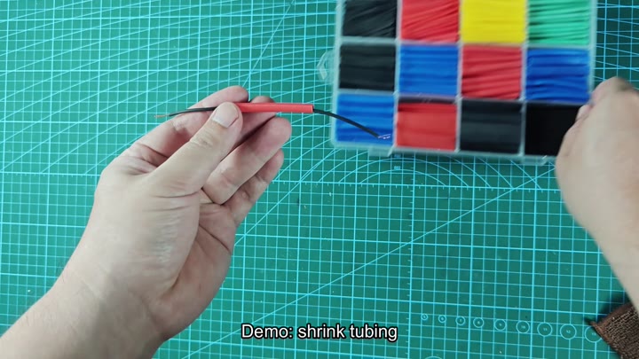 Applying heat to shrink tubing on wire Applying heat to shrink tubing on wire