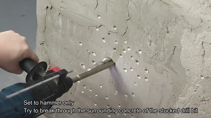 Breaking surrounding concrete to free bit Breaking surrounding concrete to free bit