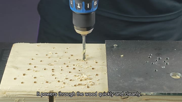 Drill powering through wood with shavings Drill powering through wood with shavings