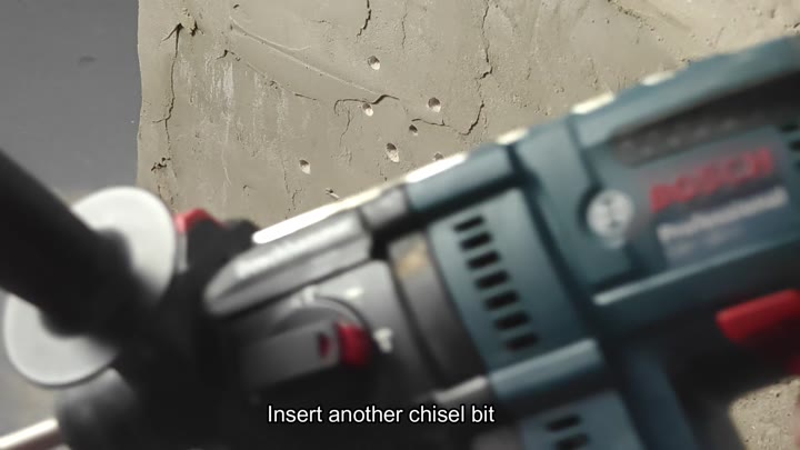 Inserting new chisel bit into tool Inserting new chisel bit into tool