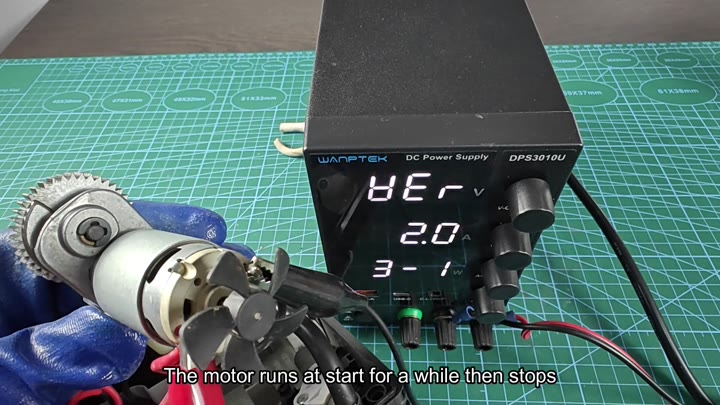 Inspecting disassembled motor with exposed brushes Inspecting disassembled motor with exposed brushes