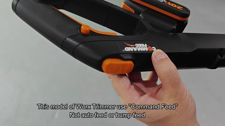 Orange command feed button on trimmer Orange command feed button on trimmer