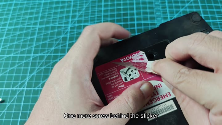Peeling sticker to reveal hidden screw Peeling sticker to reveal hidden screw