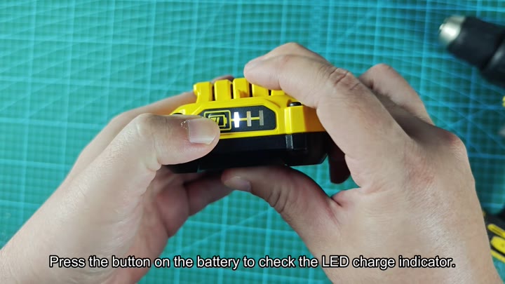 Pressing button to check LED charge indicator