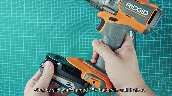 Sliding RIDGID 18V battery into drill Sliding RIDGID 18V battery into drill